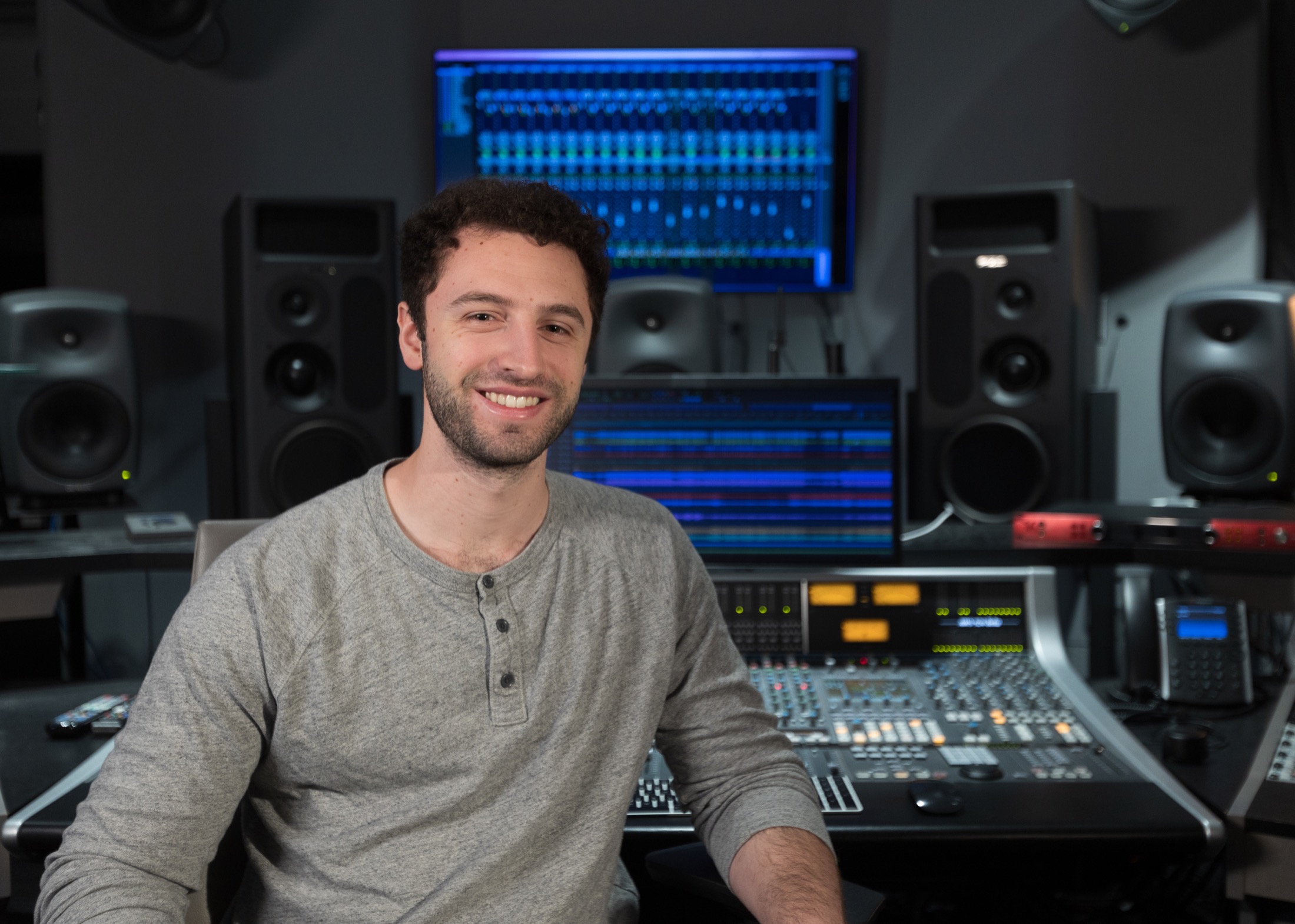 Joshua Weinfeld seated in a recording studio